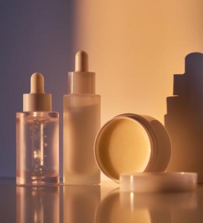 Cosmetic products for skin care in the rays of the setting sun. Cosmetic products for skin care in the rays of the setting sun. High quality photo.